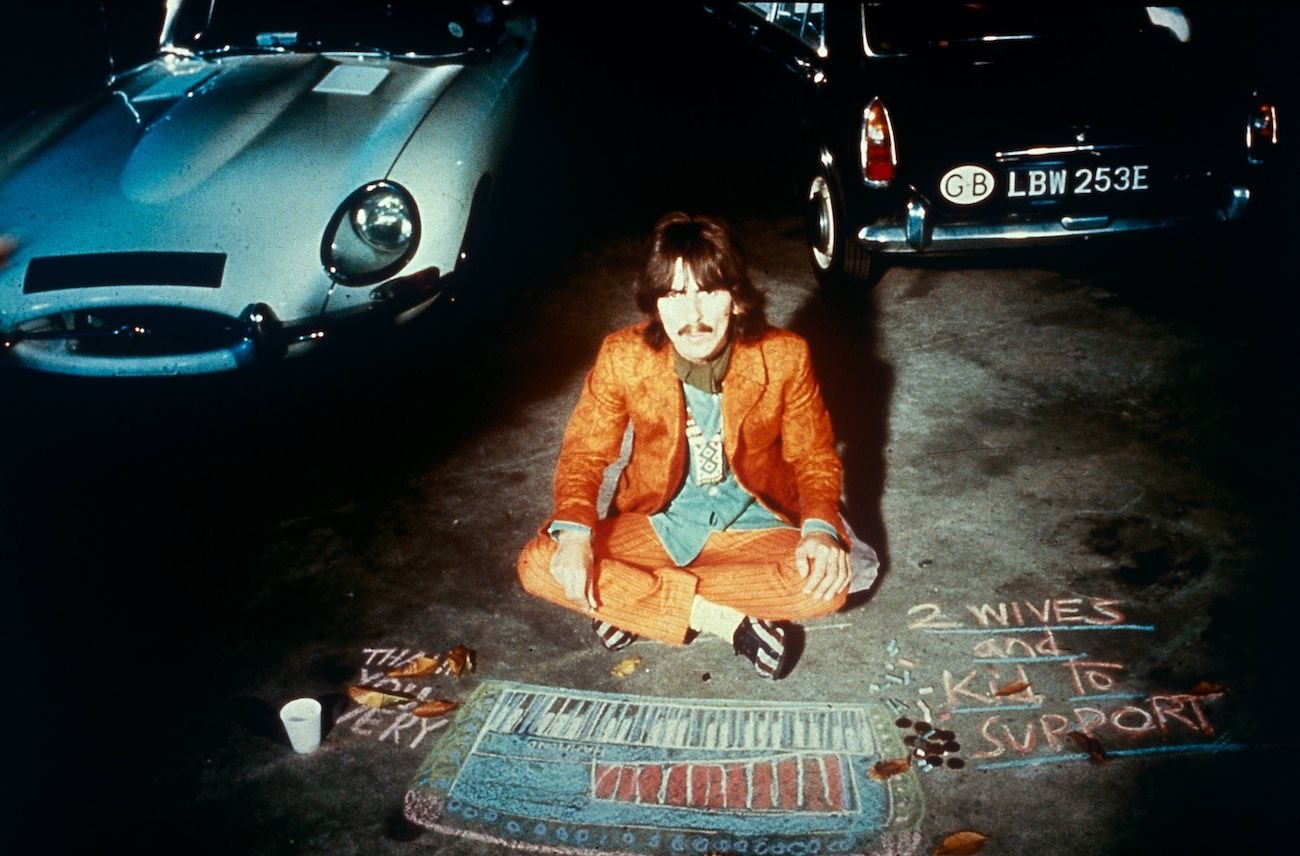 George Harrison in orange in 1967.