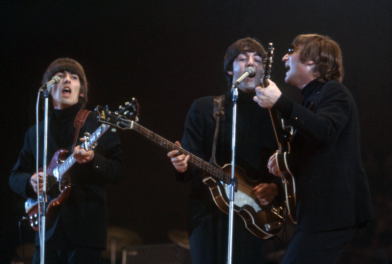 George Harrison and The Beatles performing in London, 1966.