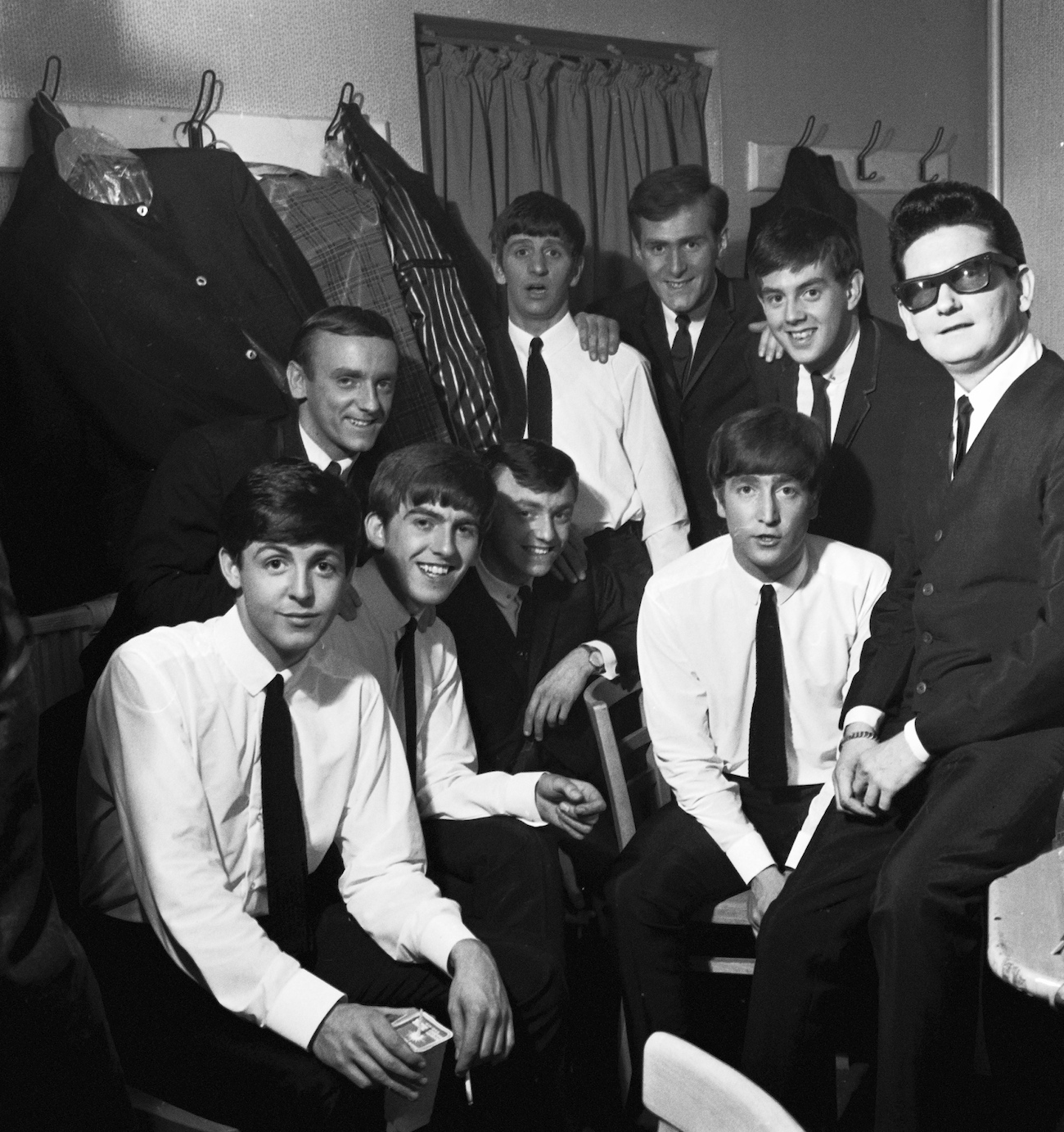 The Beatles backstage with Roy Orbison while on tour in 1963.