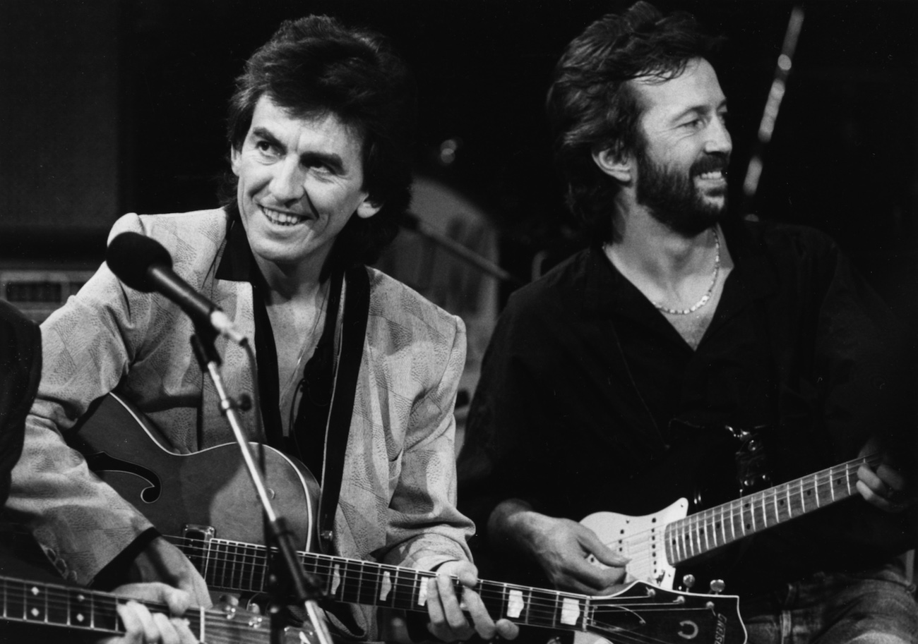 George Harrison and Eric Clapton performing during a TV special for Carl Perkins in 1985.