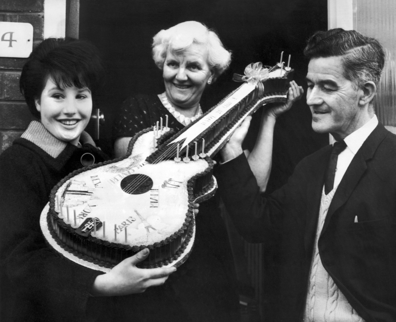 George Harrison's parents with a fan in 1964.