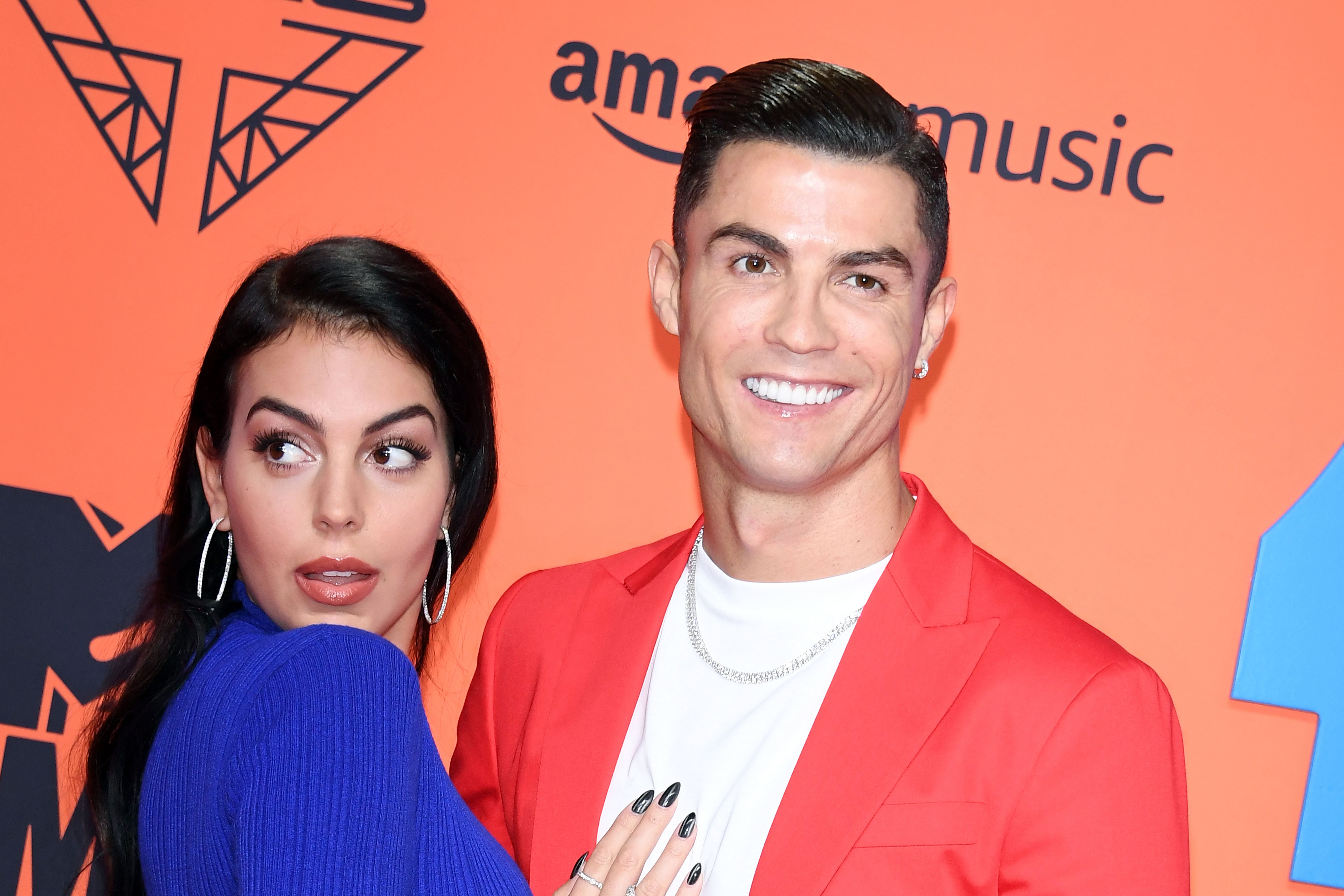 Georgina Rodriguez and Cristiano Ronaldo pose on the carpet together at the MTV EMAs