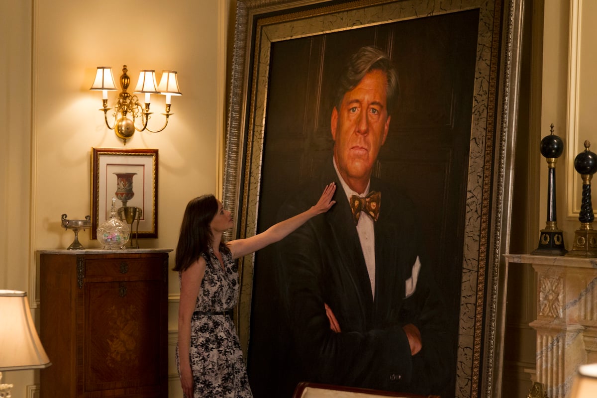 'Gilmore Girls' actor Alexis Bledel as Rory Gilmore touching a wall-size portrait of Richard Gilmore (Edward Herrmann)