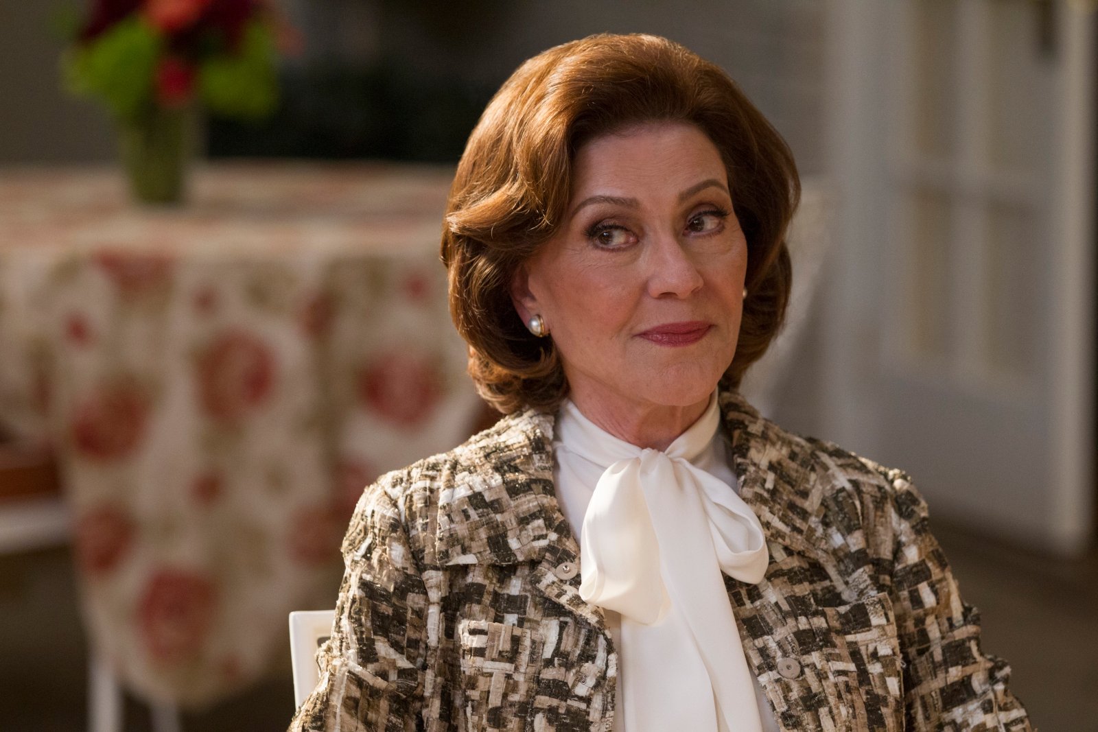 Kelly Bishop as Emily Gilmore in 'Gilmore Girls: A Year inthe Life.' She's wearing a white blouse and blazer.