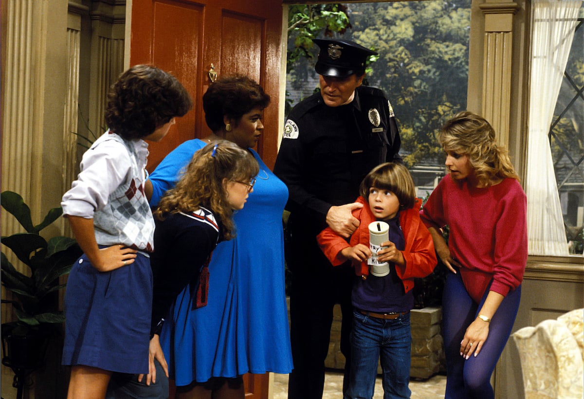 The cast of Gimme a Break films a scene with Nell Carter and Joey Lawrence