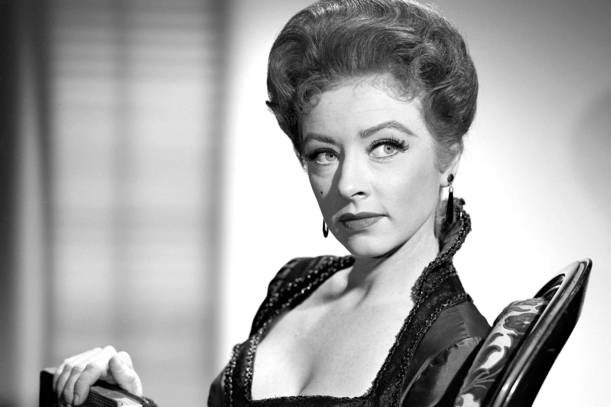 'Gunsmoke' Amanda Blake as Miss Kitty Russell in a black-and-white picture looking off to the side.