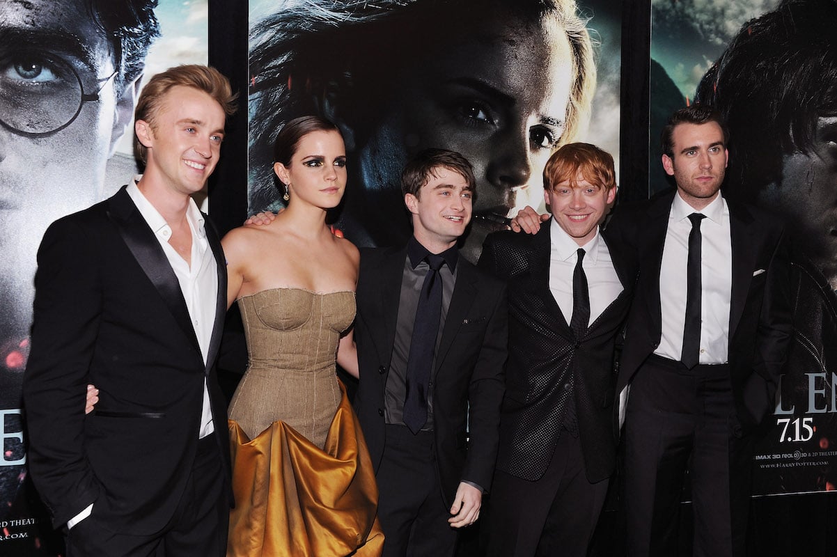 'Harry Potter': Tom Felton, Emma Watson, Daniel Radcliffe, Rupert Grint, and Matthew Lewis interlock arms at the "Deathly Hallows: Part 2' premiere
