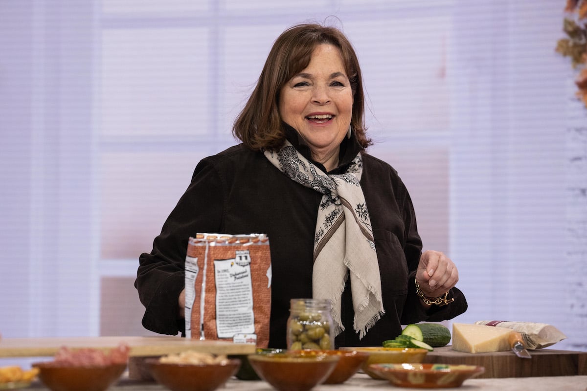 Ina Garten, whose brownie pudding is now a go-to dessert, smiles wearing a black shirt and scarf on 'Today'