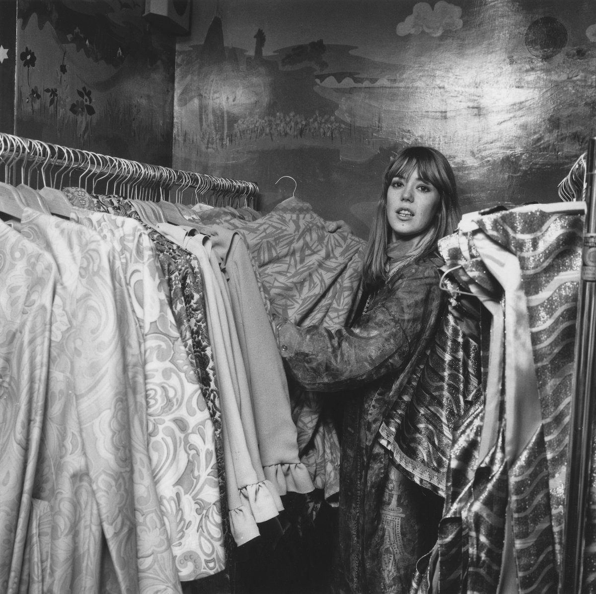 Jenny Boyd, who was married to Fleetwood Mac founder Mick Fleetwood and inspired the Donovan song "Jennifer Juniper," pulls a shirt from a rack of clothing.