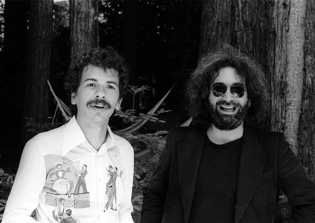 Carlos Santana and Jerry Garcia smiling, in black and white