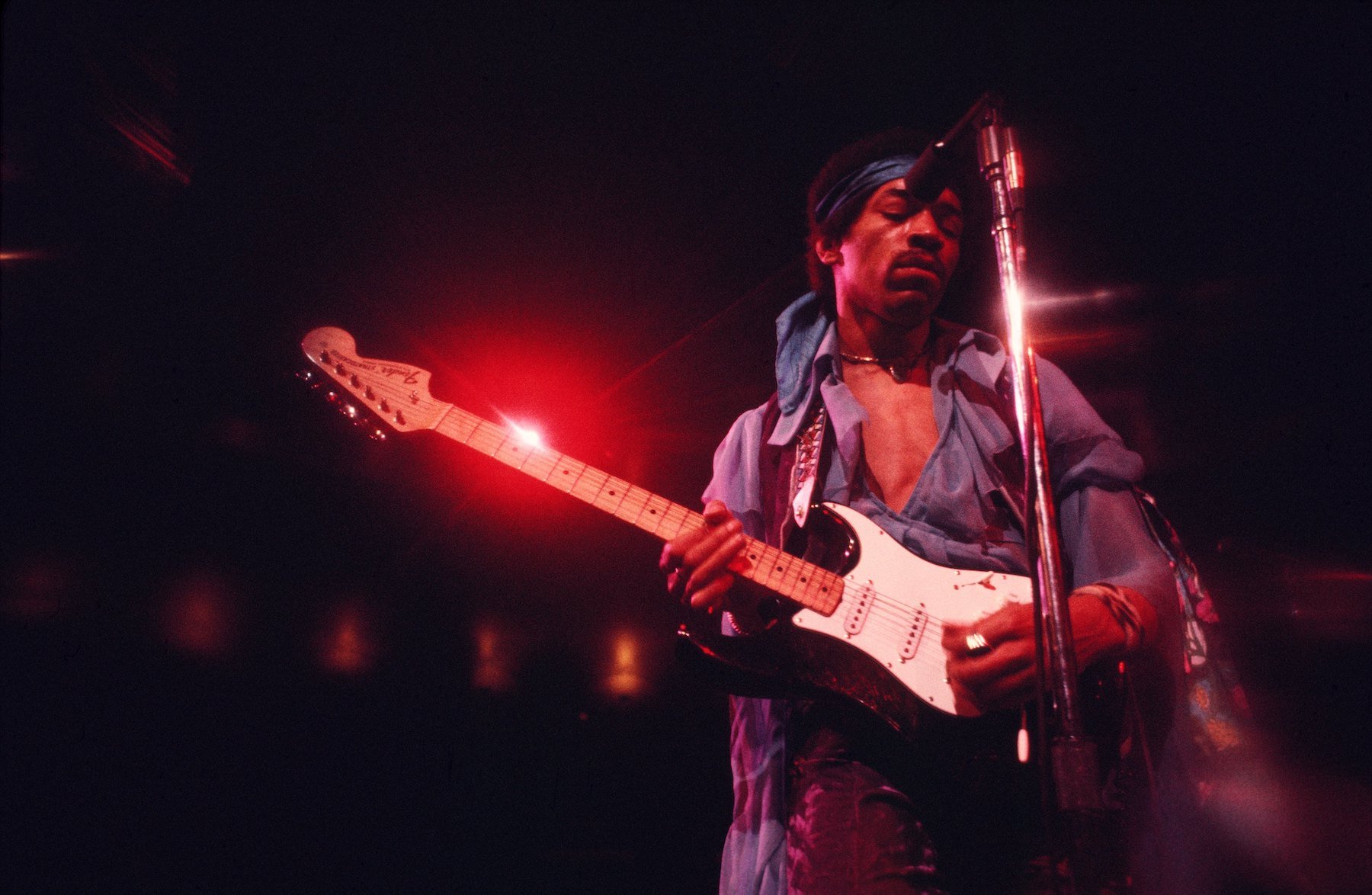 Jimi Hendrix, whose brother used to help him spy on girls, playing guitar