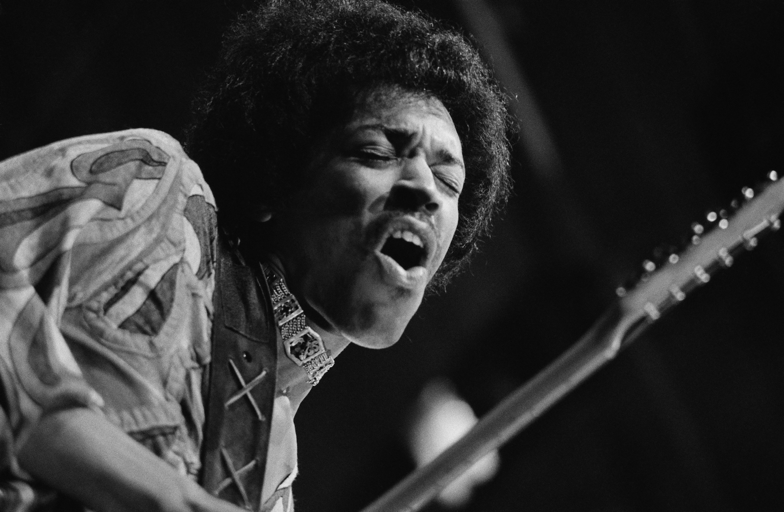 Jimi Hendrix playing his electric guitar