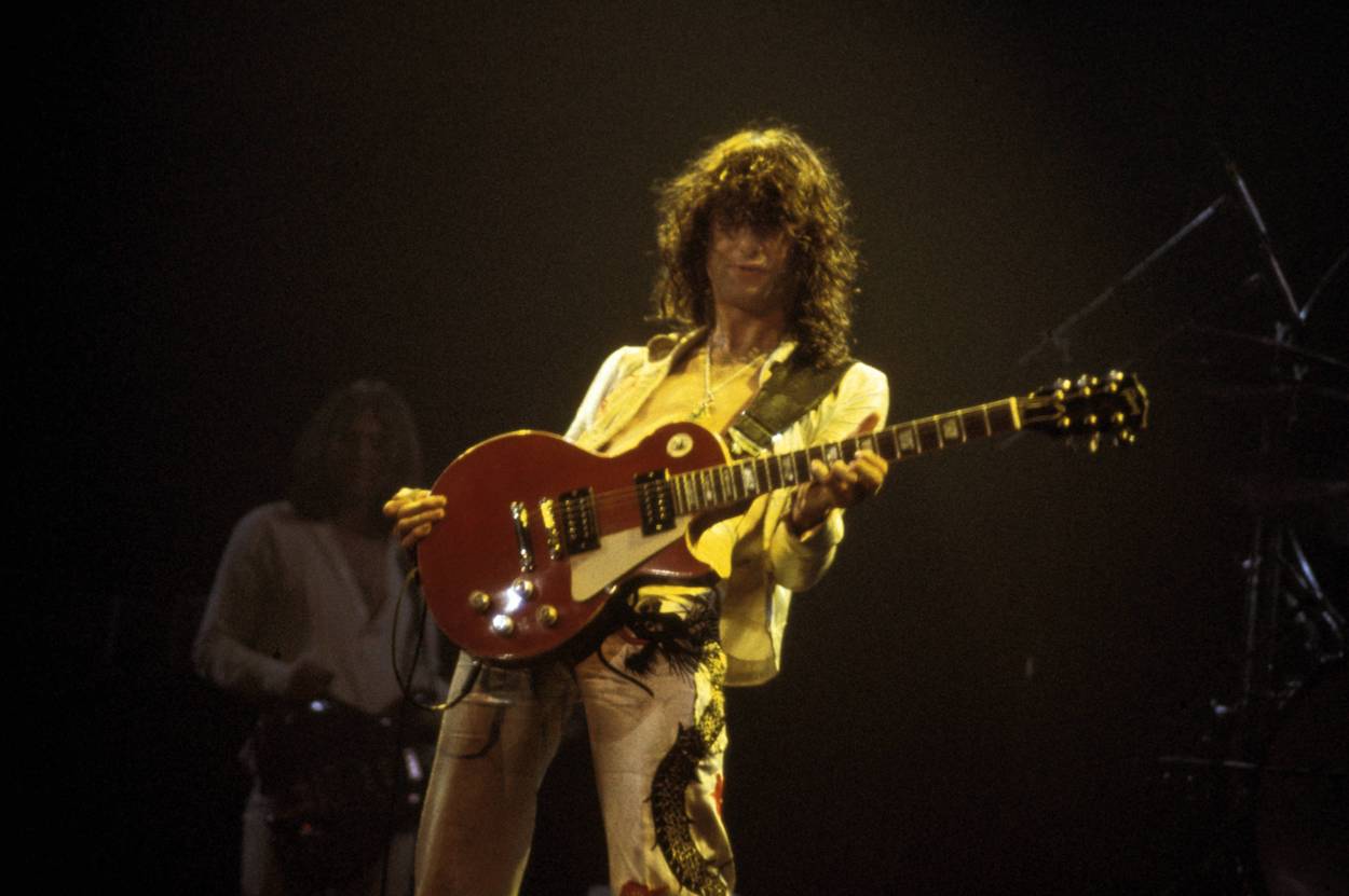 Jimmy Page, who brought more than one skill to Led Zeppelin from his session musician days, performs during a 1977 Led Zeppelin concert.