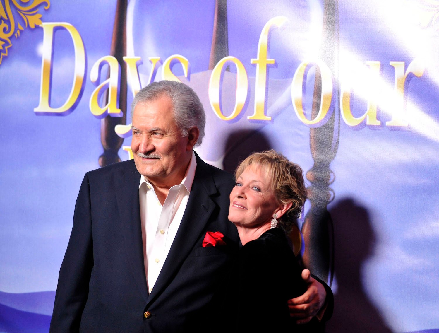 John Aniston and wife Sherry Rooney posing at a 'Days of Our Lives' event
