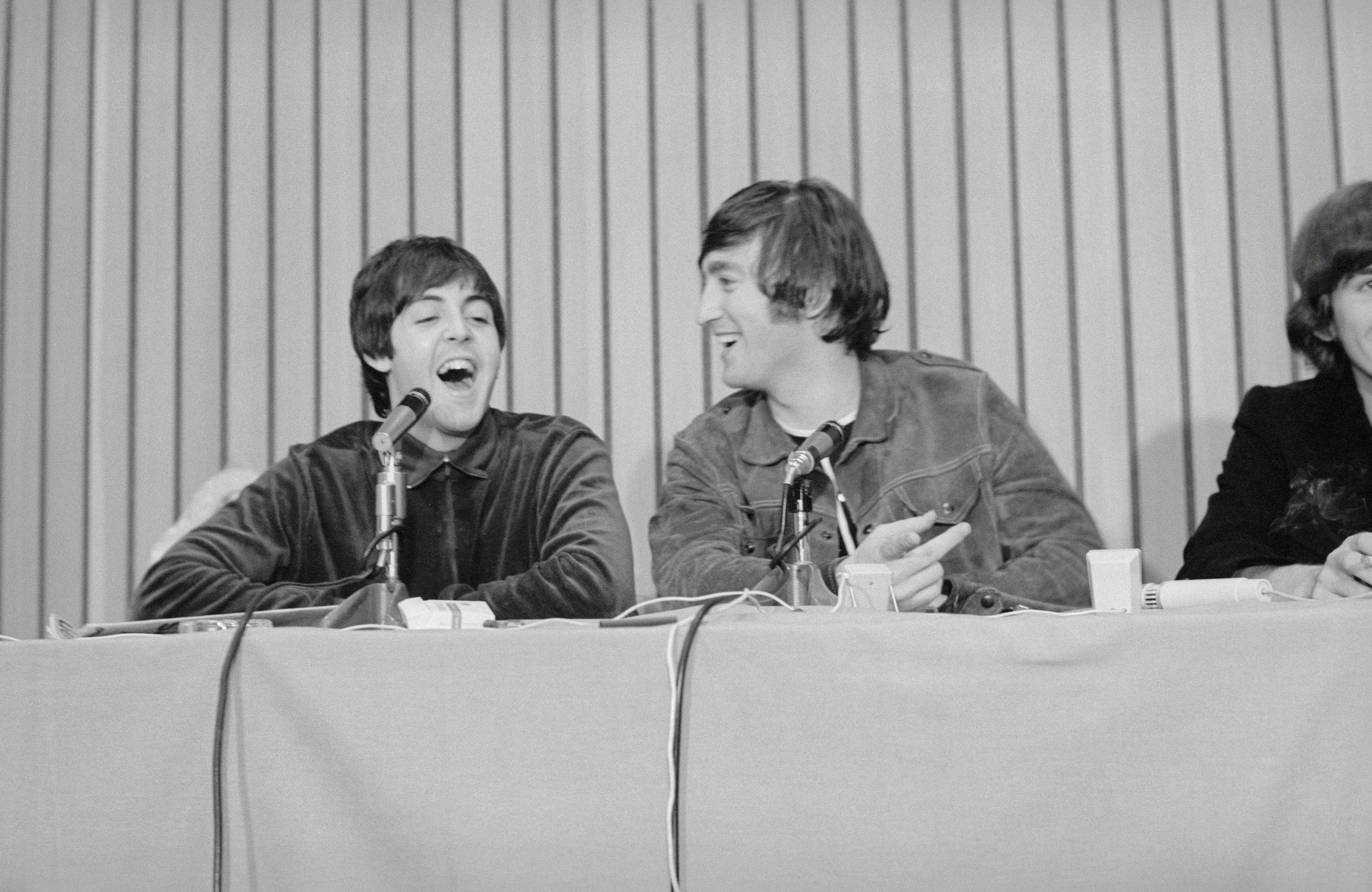 John Lennon and Paul McCartney attend a press conference 
