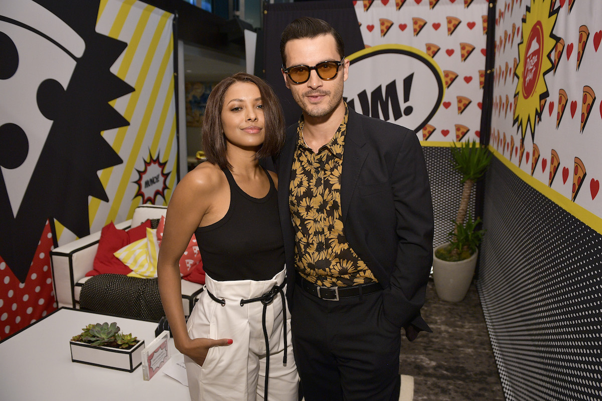 Kat Graham and Michael Malarkey smiling