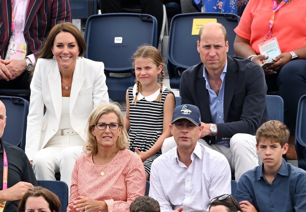 Kate Middleton, Princess Charlotte, Prince William, Sophie, who, according to body language expert Judi James hinted at bridging 'emotional gap' with Prince William and Kate Middleton via hugs, sit with Prince Edward and James, Viscount Severn at the 2022 Commonwealth Games