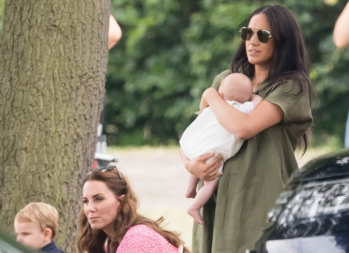 Kate Middleton, who Meghan refused to allow to take photos of Archie, and Prince Louis along with Meghan Markle and her son attend The King Power Royal Charity Polo Day