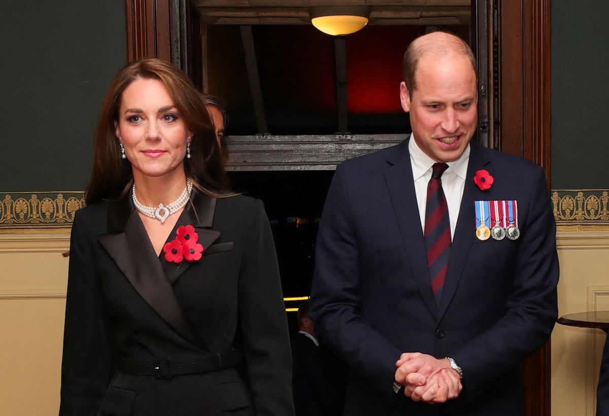 Kate Middleton and Prince William, who laid a wreath on Nov. 13, 2022, during a National Service of Remembrance, walk together wearing black