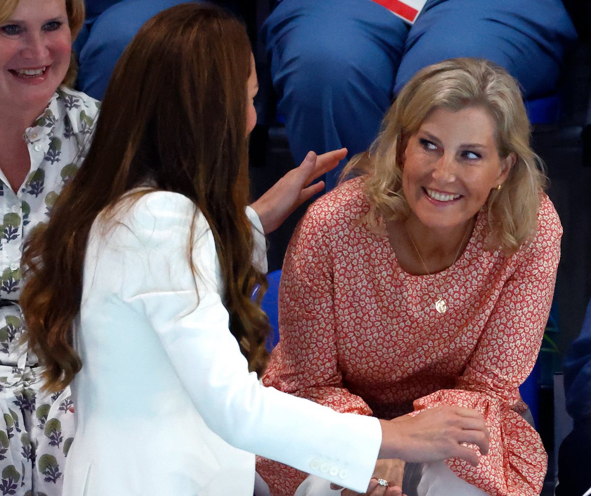 Sophie, who, according to body language expert Judi James bridged the 'emotional gap' with a warm welcome for Prince William and Kate Middleton at the 2022 Commonwealth Games, smiles as she greets Kate Middleton