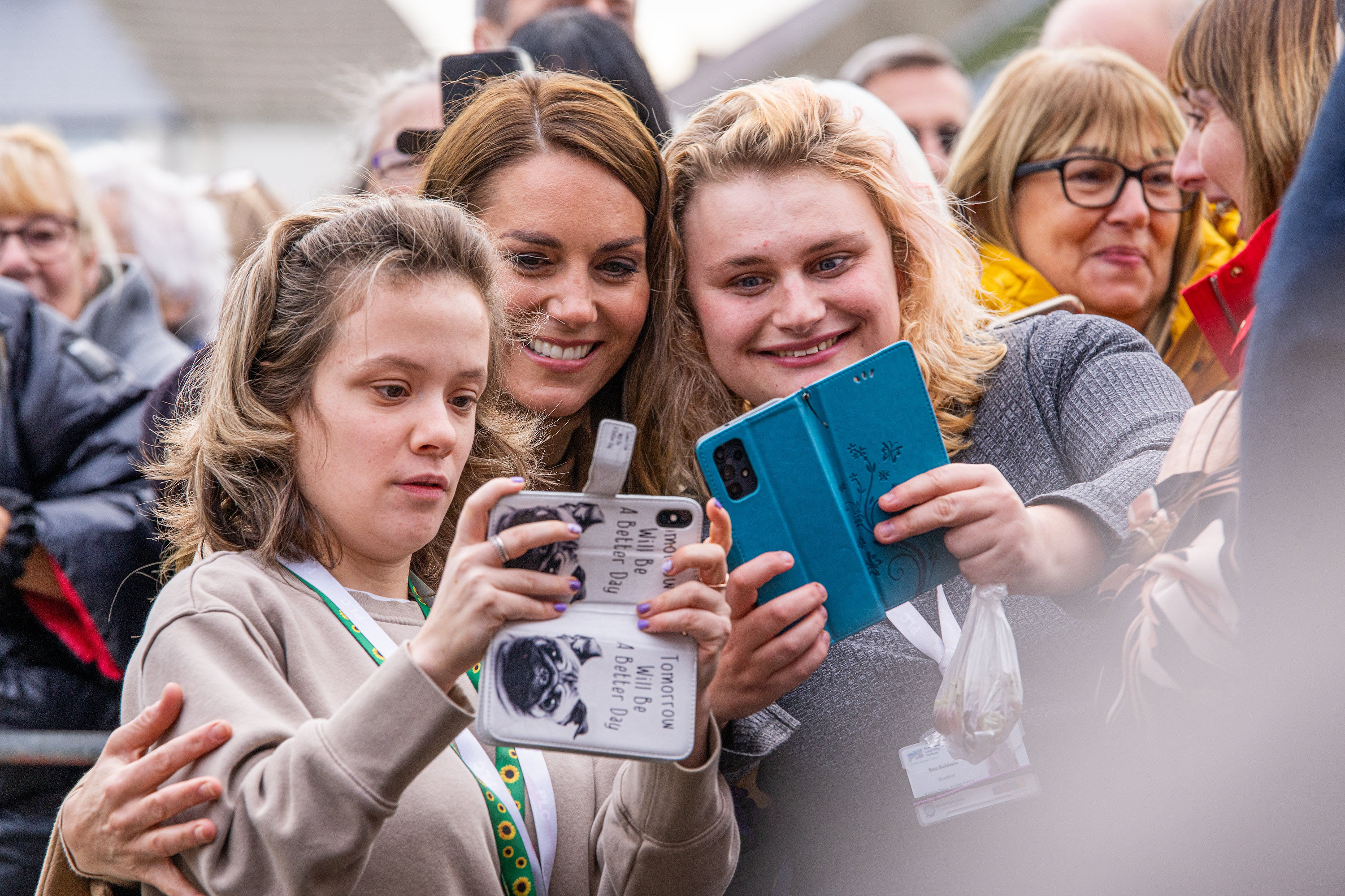 Kate Middleton takes selfies with two benefactors during her trip to Scarborough, England.