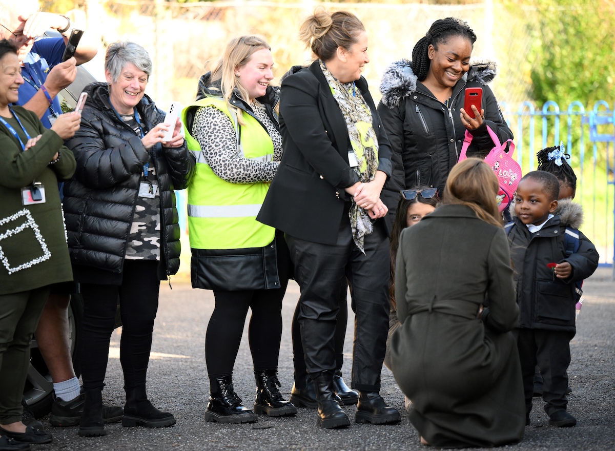 Kate Middleton, who appeared 'so natural an un-regal' according to a body language expert, while talking with Akeem, 3, after visiting Colham Manor Children's Centre on Nov. 9, 2022.