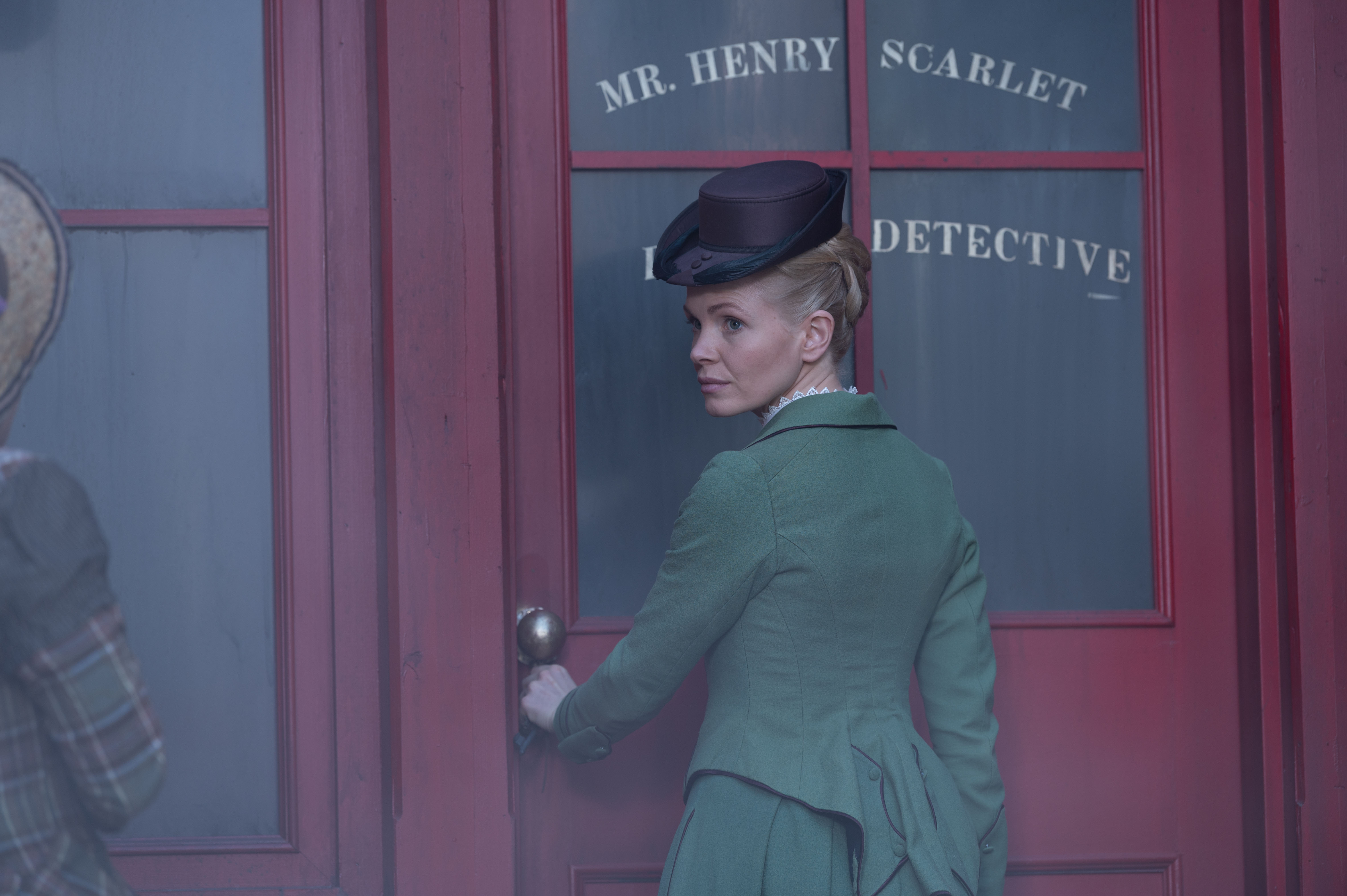 Kate Phillips as Eliza Scarlet looking over her shoulder in 'Miss Scarlet and The Duke' Season 2