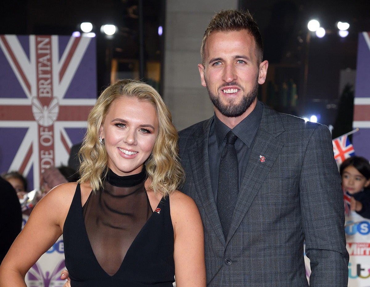 Katie Goodland and Harry Kane smile on the red carpet as they attend the Pride Of Britain Awards