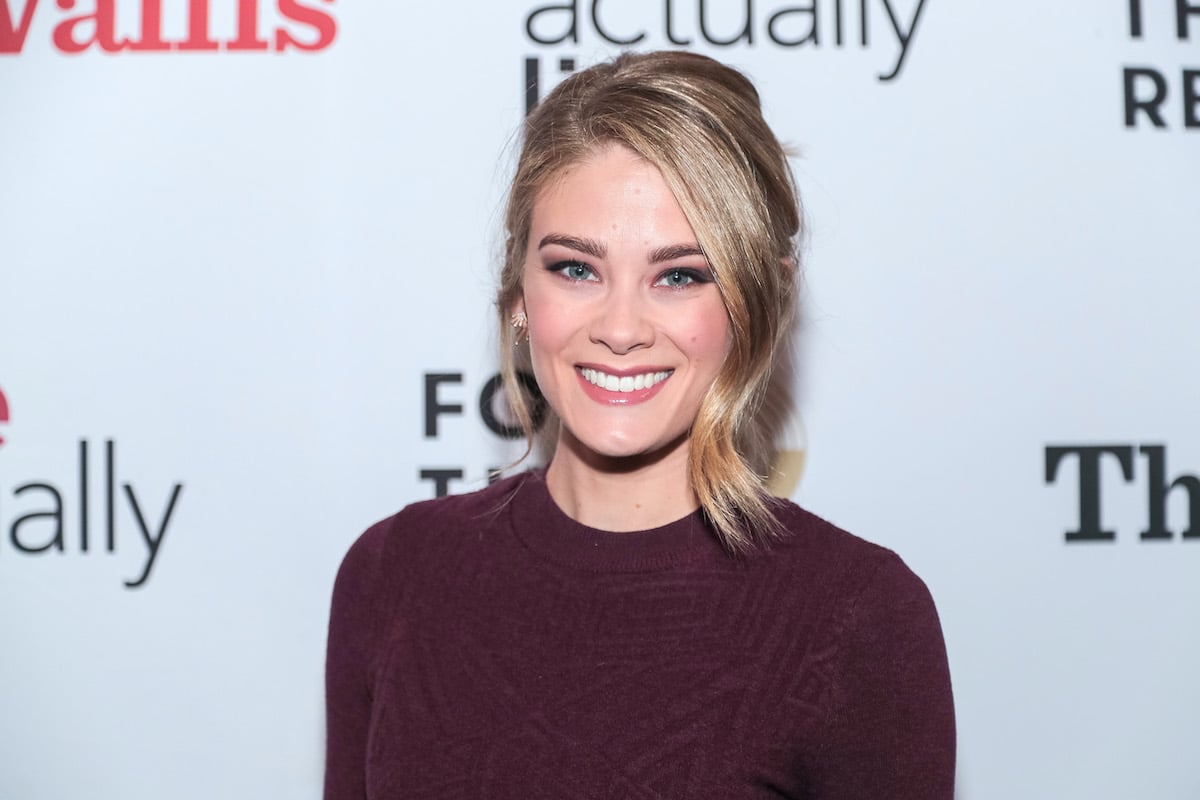 Smiling Kim Matula in a purple top at an event in 2019