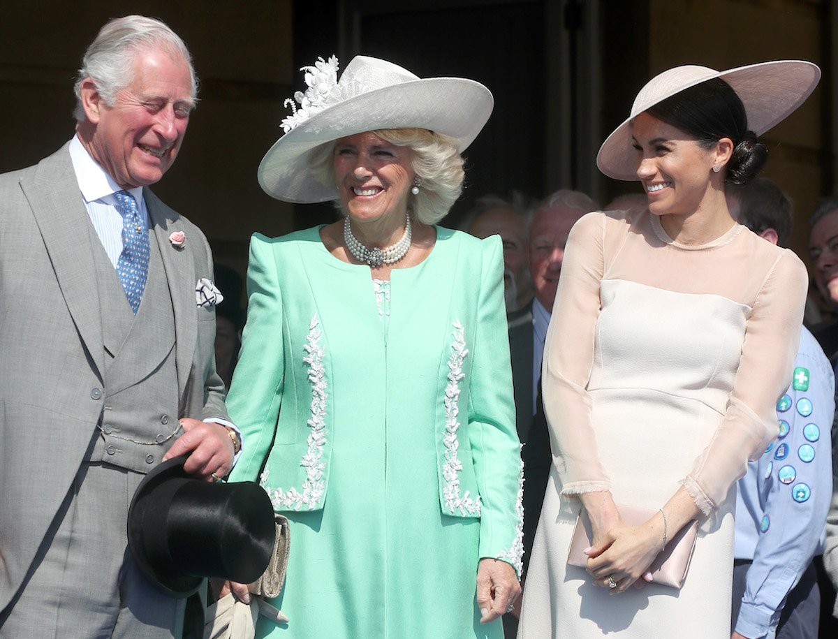 King Charles, Camilla Parker Bowles, and Meghan Markle, who 'singled out' King Charles III with her body language according to an expert, in May 2018