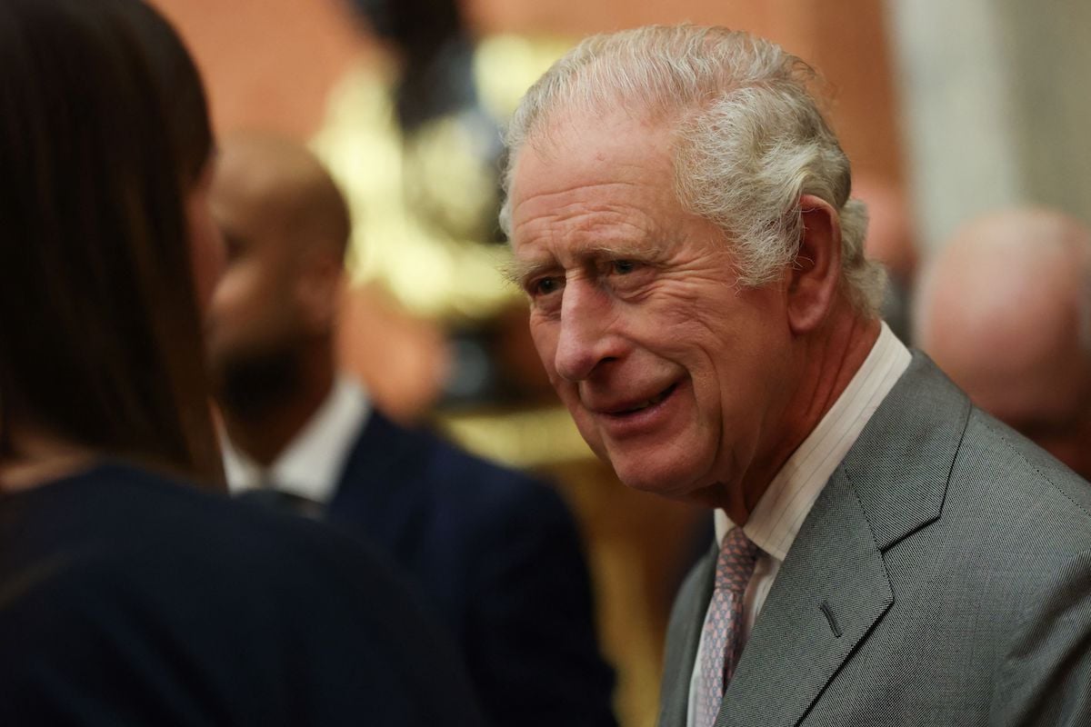 King Charles, whose 'fears' about the start of his reign being overshadowed by his past haven't been 'unfounded', according to royal expert Katie Nicholl, looks on wearing a gray suit