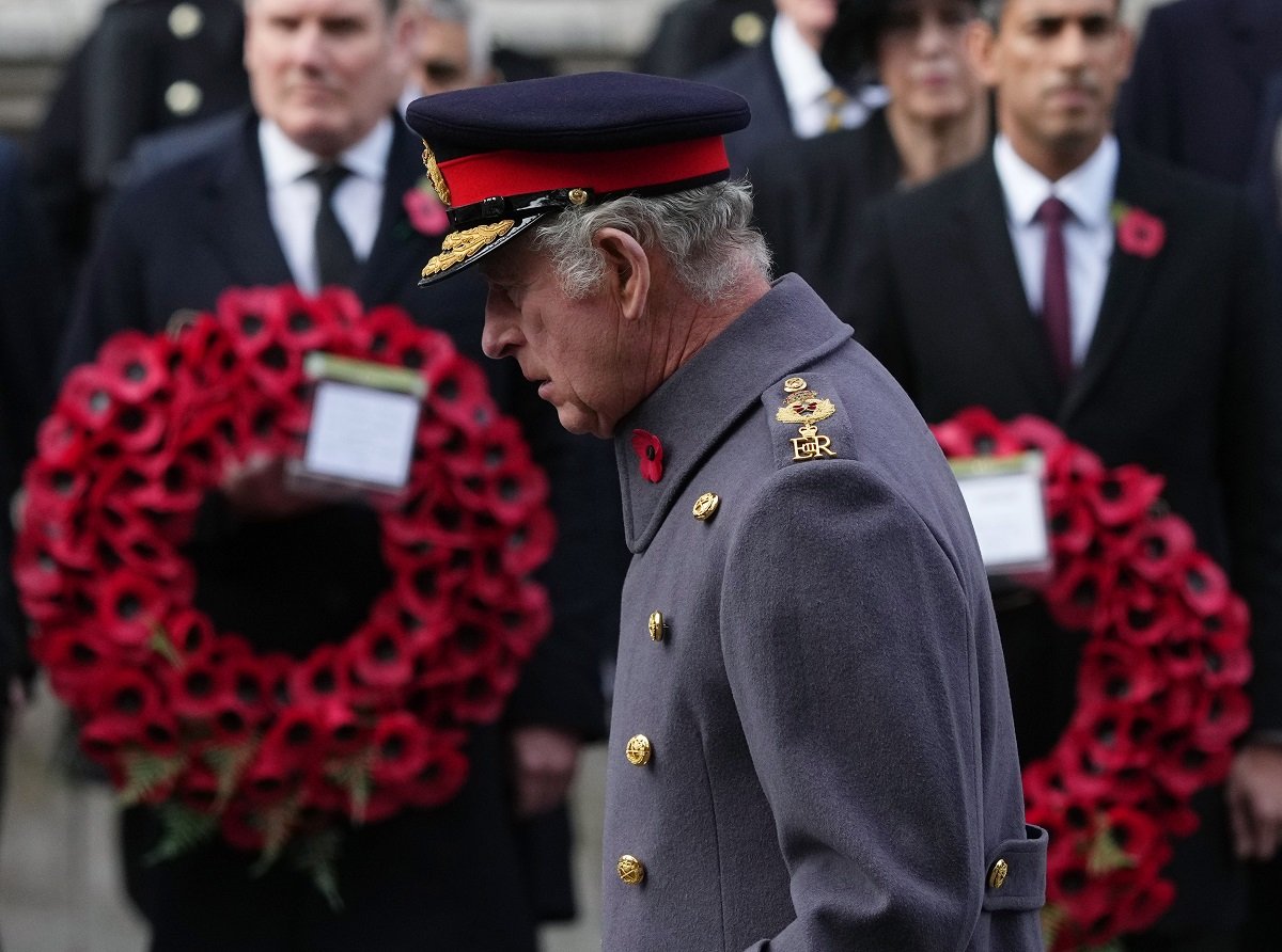 King Charles III, who a bddy language expert said looked "totally alon," during the Remembrance Sunday service at the Cenotaph