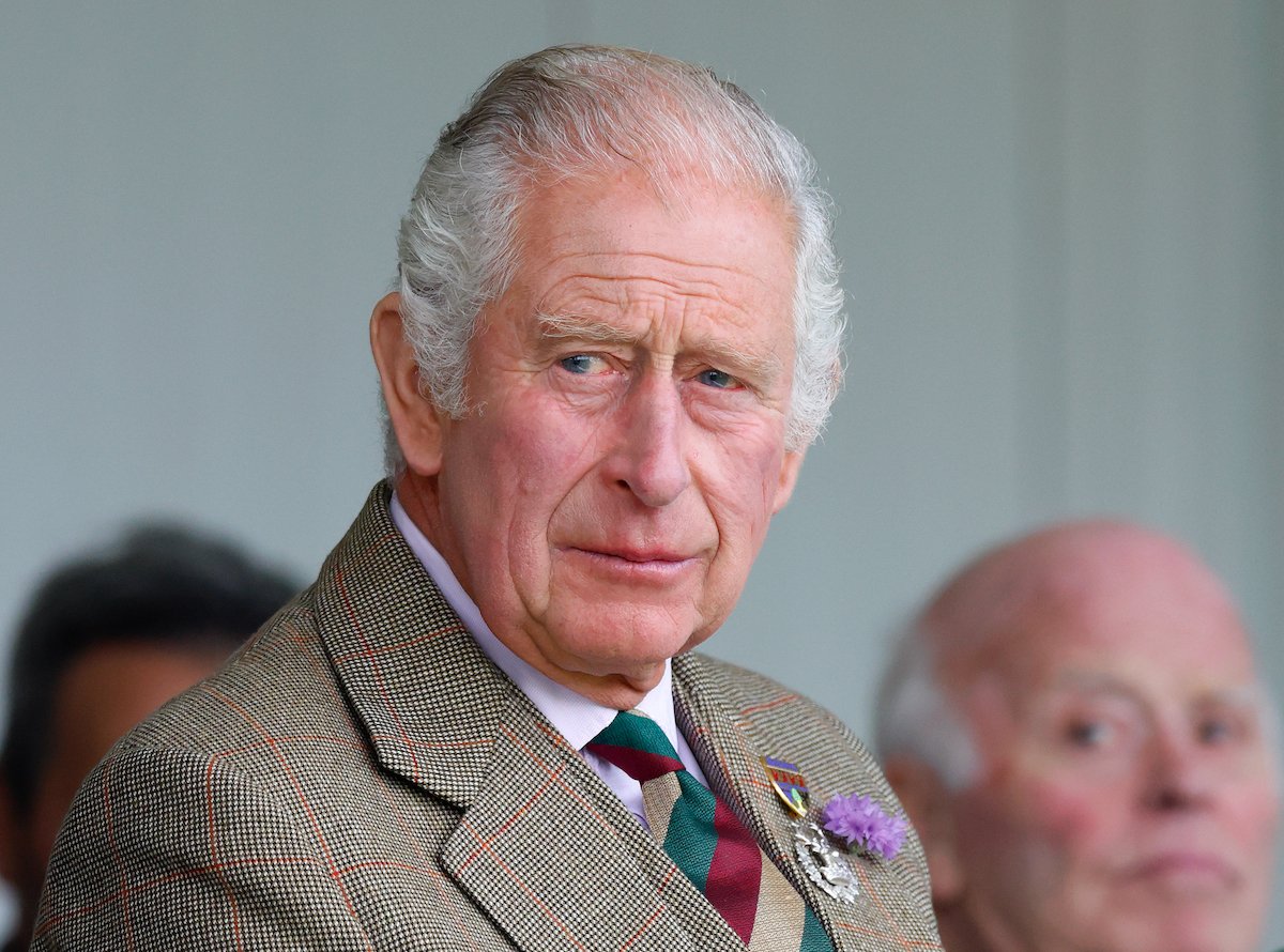 King Charles III, who 'The Crown' Season 5 does a 'big favor' for, according to Andrew Morton, looks on at the Highland Games in September 2022.