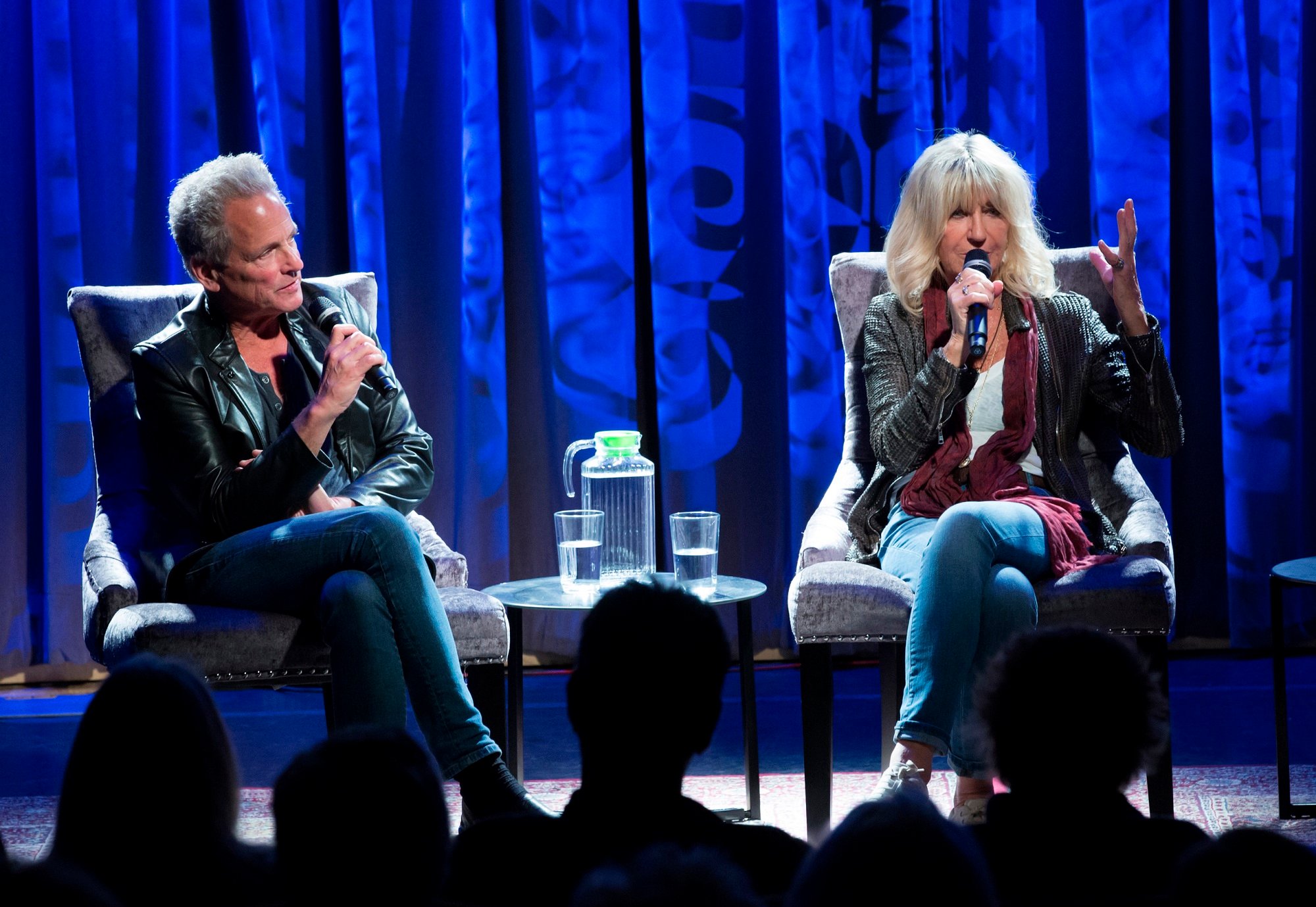 Lindsey Buckingham and Christine McVie sit side-by-side in chairs