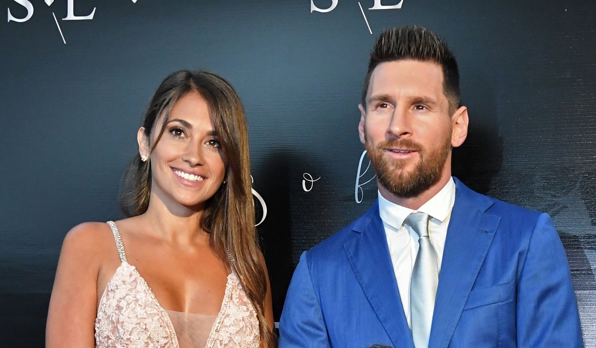 Lionel Messi and his wife Antonella Roccuzzo pose for photos as they arrive at party thrown by Luis Suarez