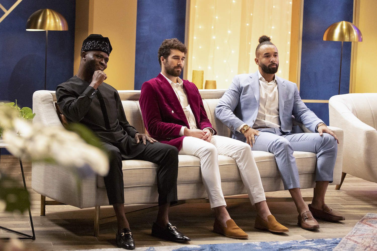 'Love Is Blind' star Bartise sits next to castmates Cole and SK on a couch at the reunion.