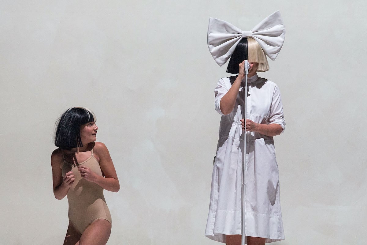 Maddie Ziegler and Sia performing on stage at Key Arena