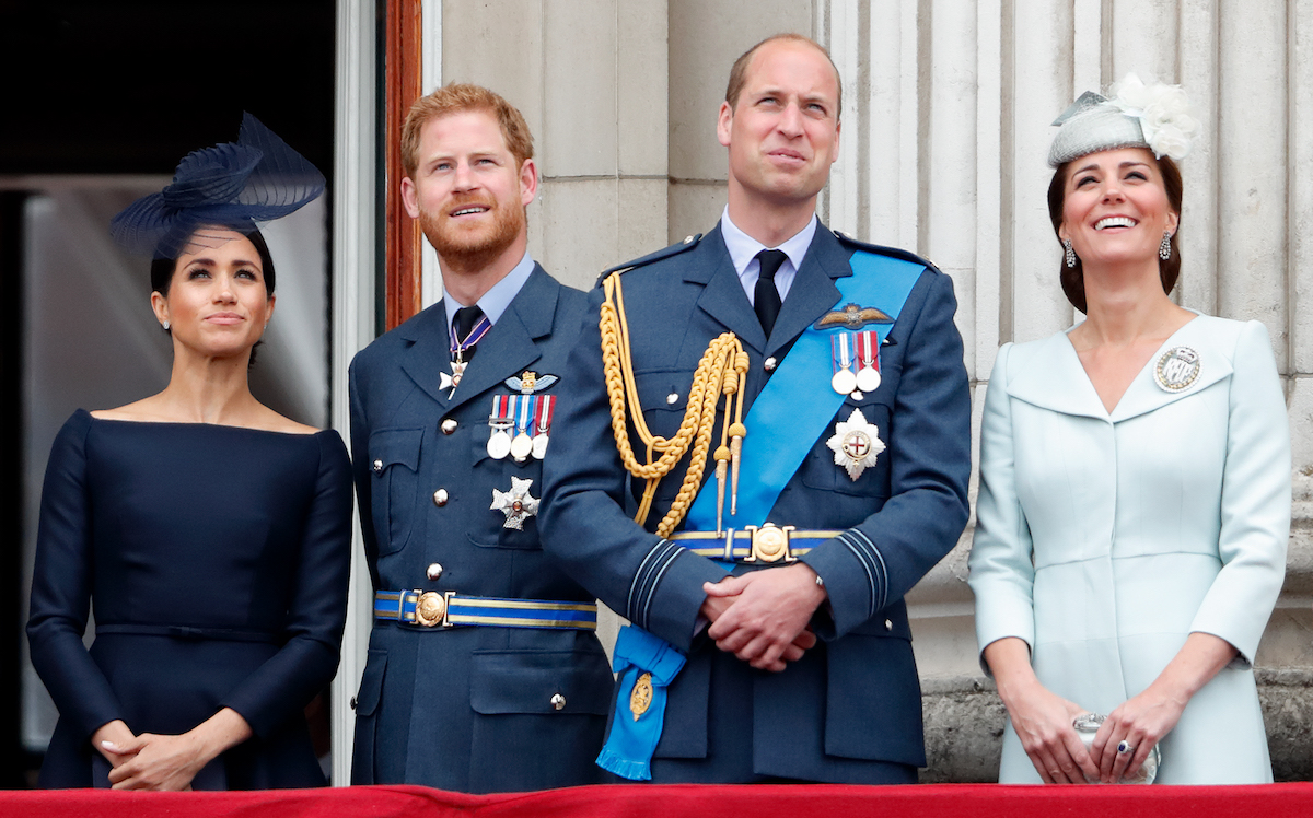 Meghan Markle, Prince Harry,Prince William, and Kate Middleton, whose gala appearances in December 2022 tell the 'Sussex story in a nutshell' according to a commentator, stand together on the Buckingham Palace balcony