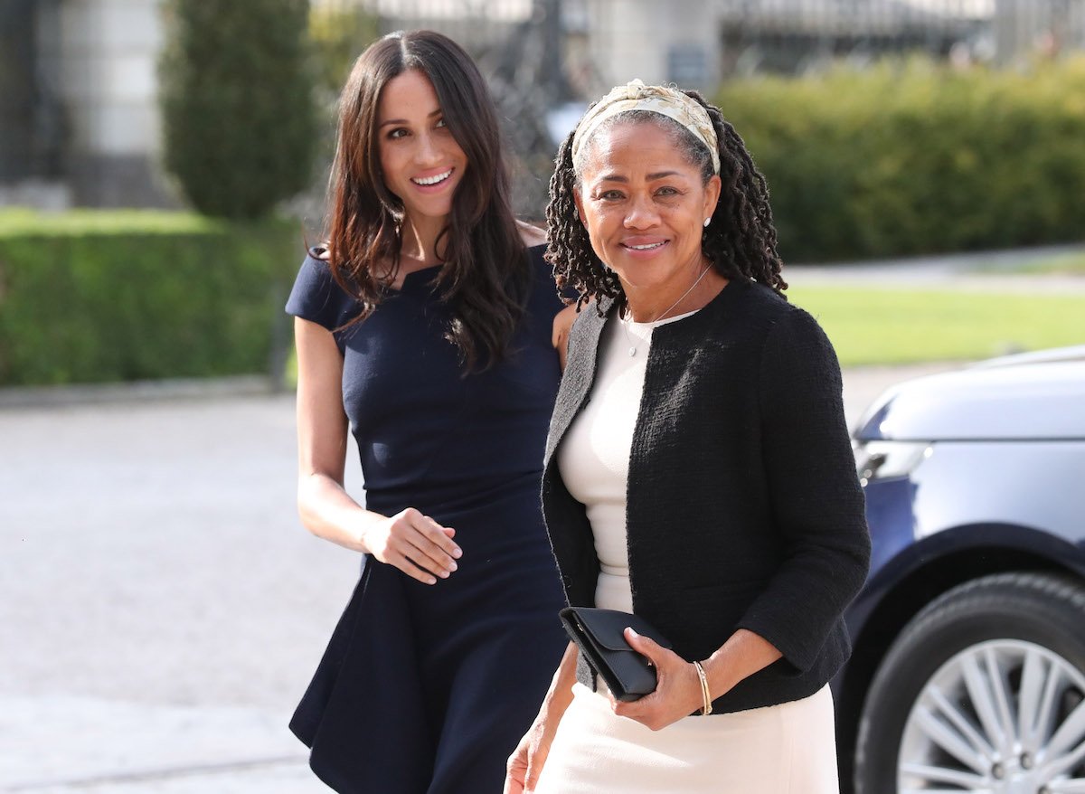 Meghan Markle and her mother, Doria Ragland, who was in mom 'mode' on the Nov. 1 episode of 'Archetypes' according to body language expert Judi James, walk together and look on
