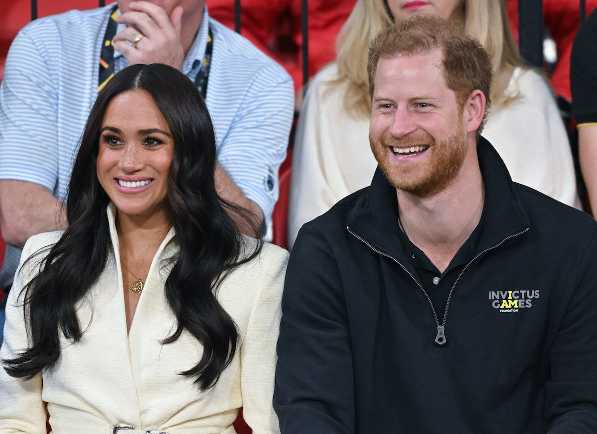 Meghan Markle and Prince Harry smiling at the Invictus Games 2020