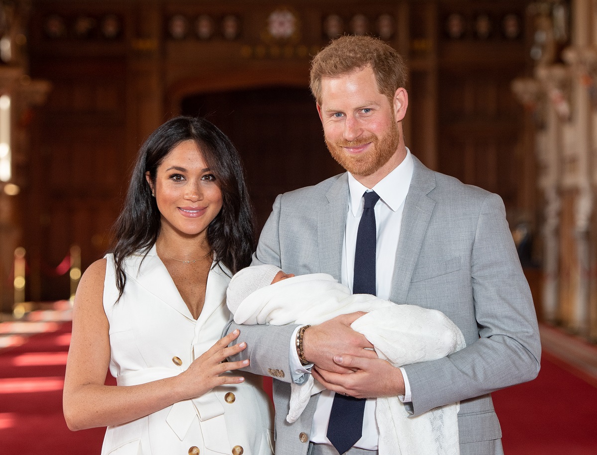 Meghan Markle and Prince Harry pose with their newborn son Archie Harrison Mountbatten-Windsor during a photocall at Windsor Castle