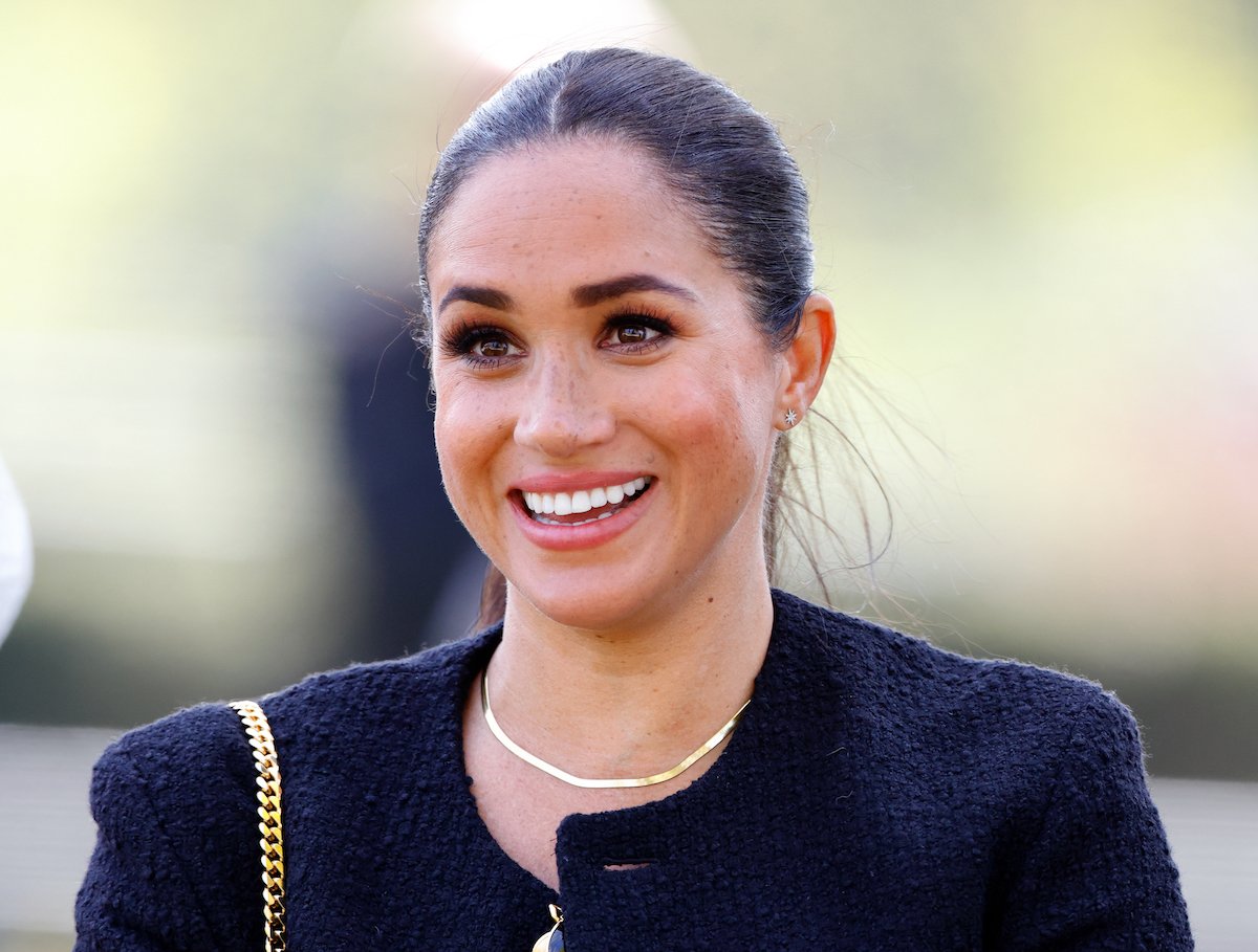 Meghan Markle, whose 'facial expression is special' in a Nov. 8 photo to encourage people to vote in midterm elections on Nov. 8, according to a body language expert, smiles and looks on