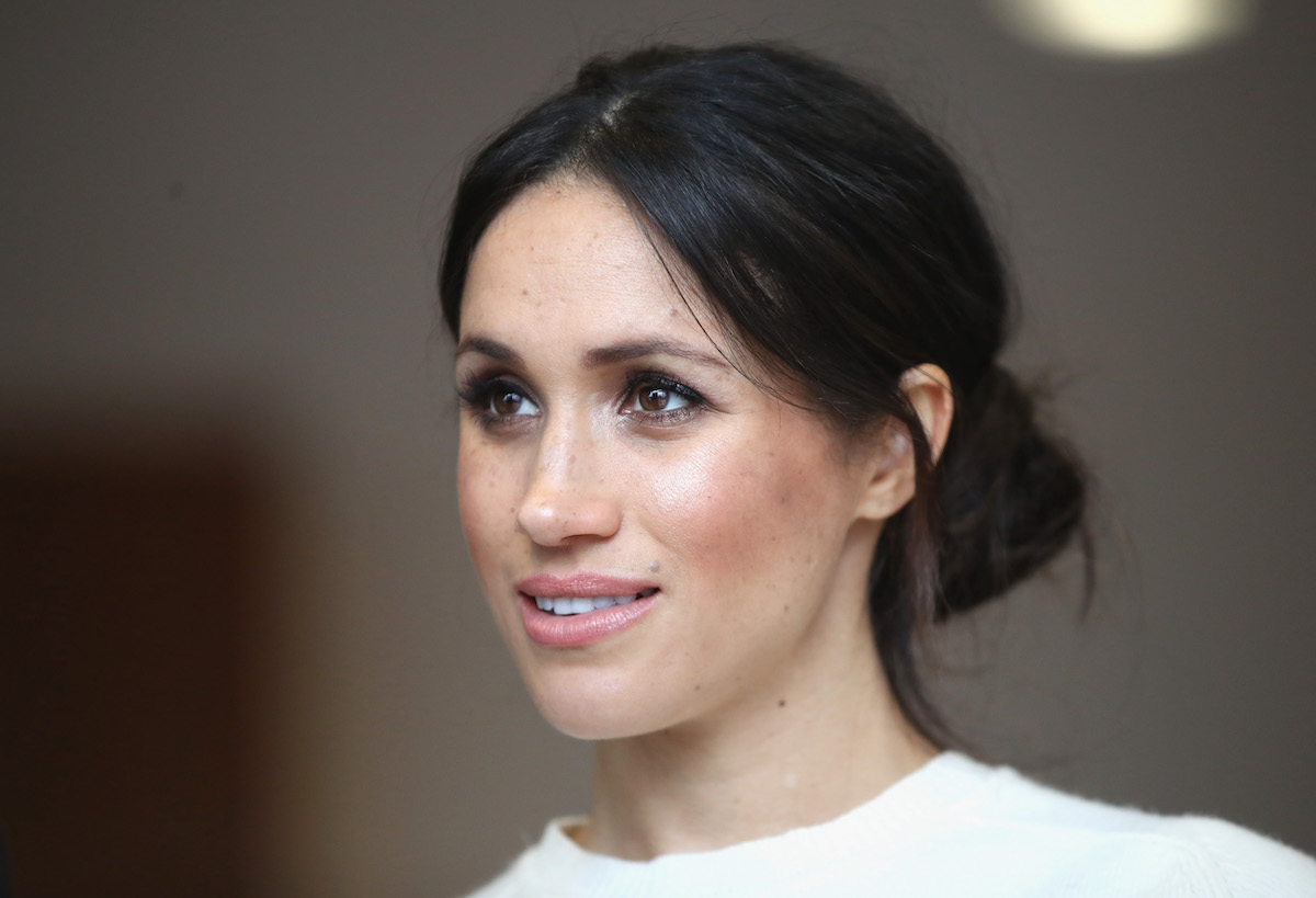 Meghan Markle, whose 'facial expression is special' in a Nov. 8 Archewell post about voting in midterm elections, according to a body language expert, looks on