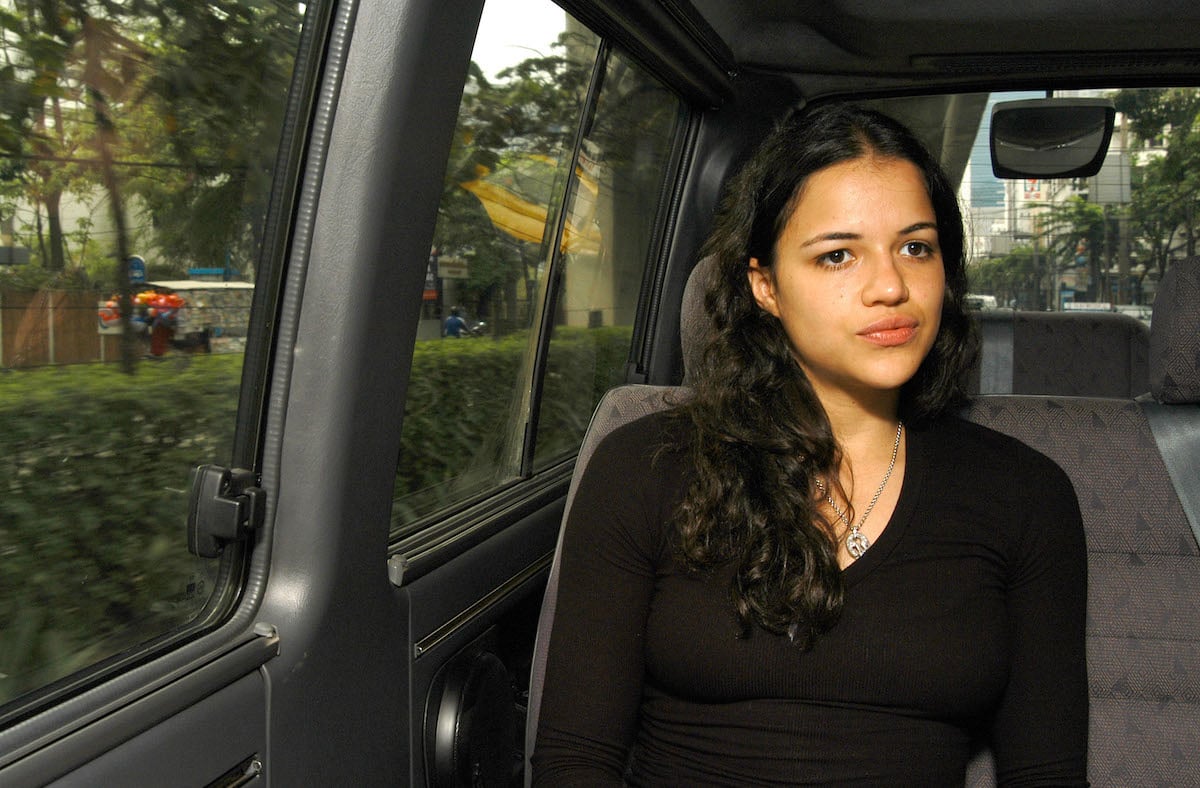 Fast & Furious Michelle Rodriguez looks pensive while riding in a car in 2004