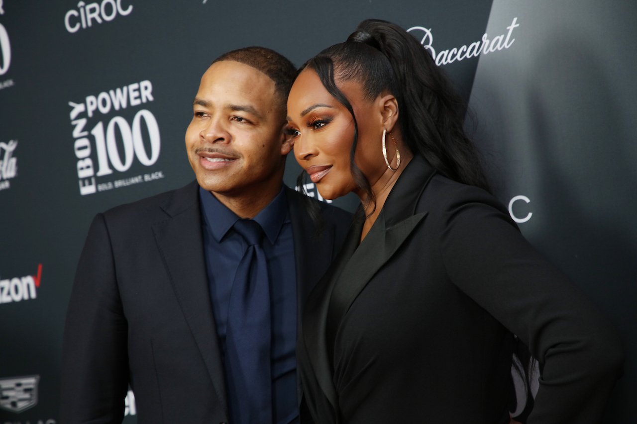 Mike Hill and Cynthia Bailey pose together on the red carpet; Bailey says their split is attributed to rift in their friendship
