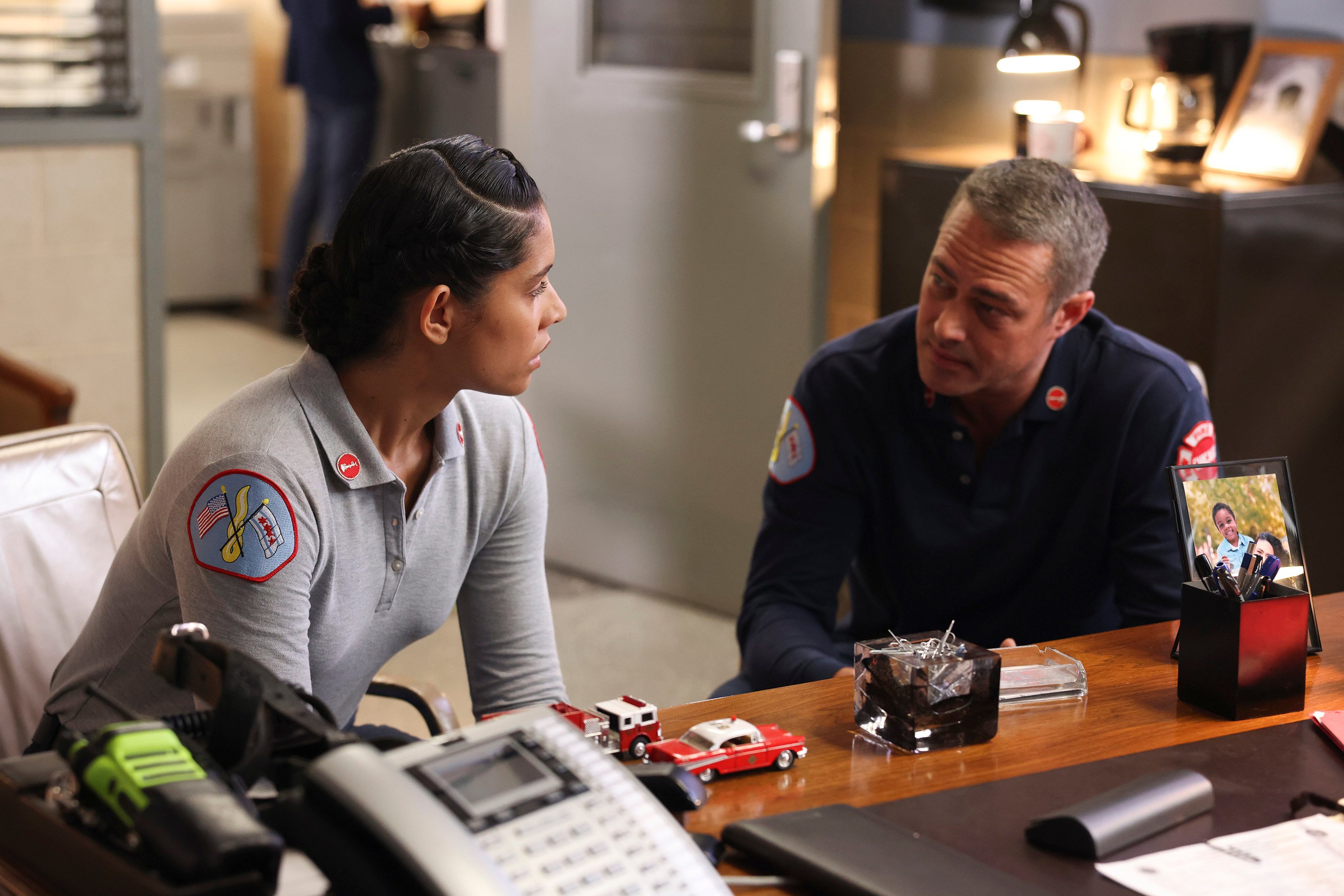 Miranda Rae Mayo as Stella Kidd and Taylor Kinney as Kelly Severide on Chicago Fire.