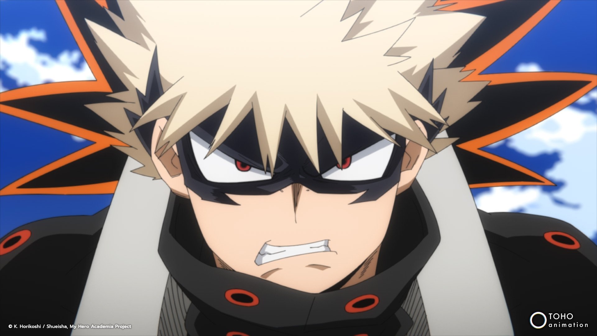 Katsuki Bakugo in 'My Hero Academia' for our article about season 6 episode 9. He's wearimg his hero mask and costume and looks angry.