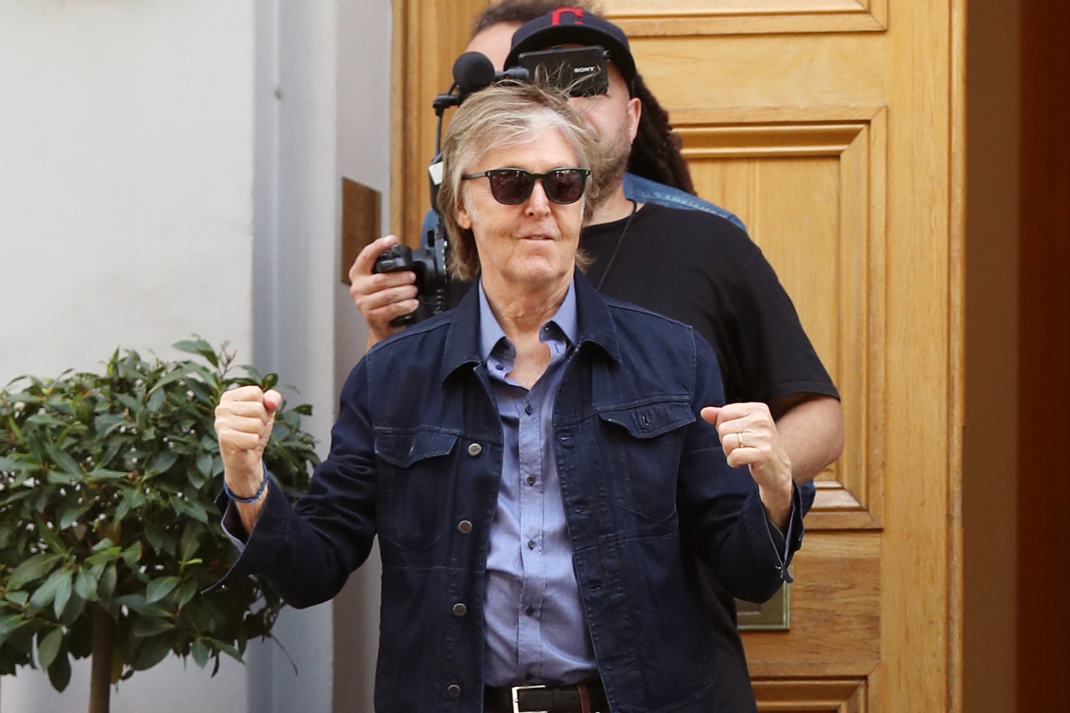 Paul McCartney seen leaving Abbey Road Studios after performing a secret gig