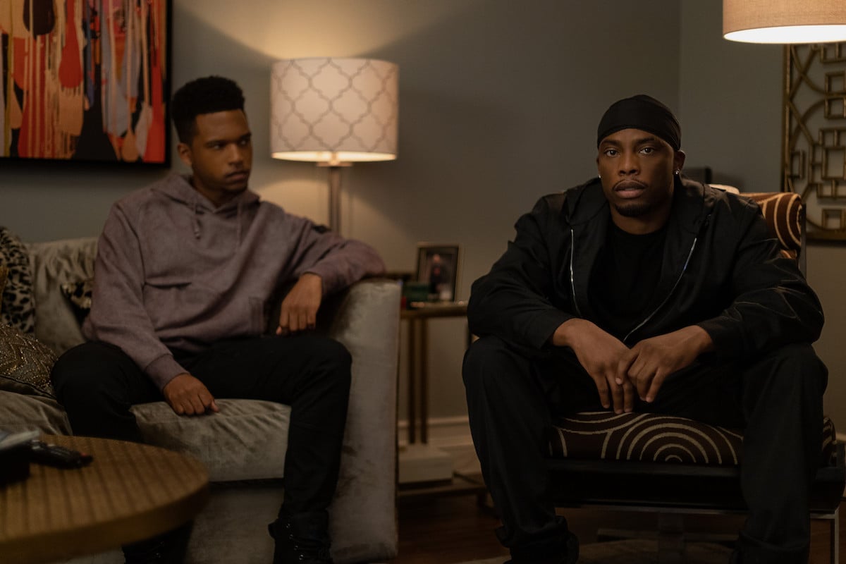 Lovell Adams-Gray as Dru Tejada and Woody McClain as Cane Tejada sitting inn the living room in 'Power Book II: Ghost'