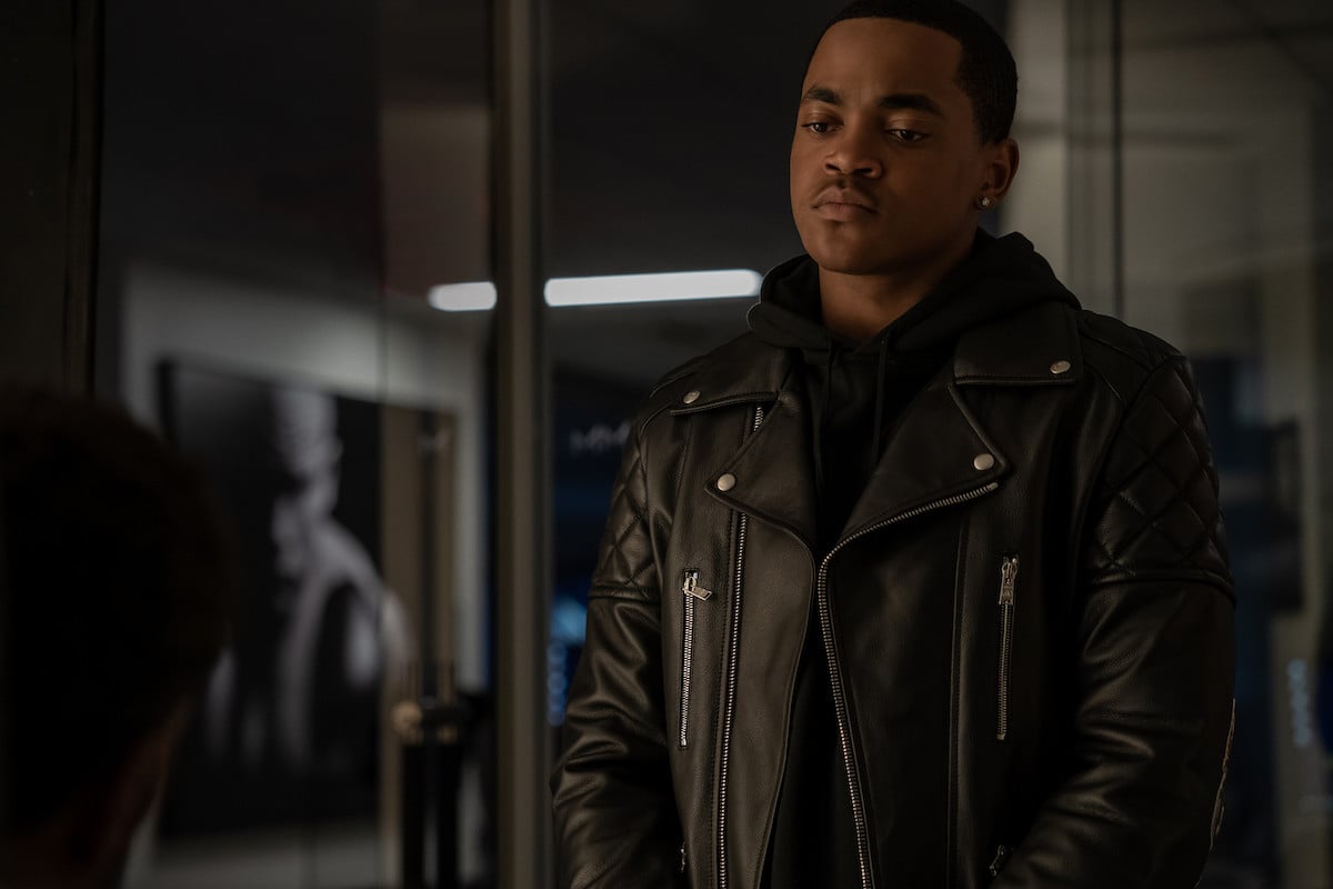 Michael Rainey Jr. as Tariq St. Patrick dressed in a black leather jacket and black hoodiein 'Power Book II: Ghost'
